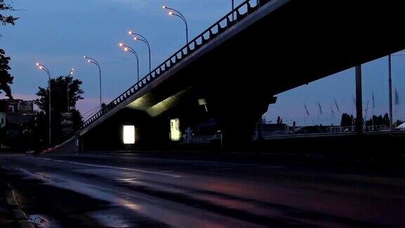 汽车时光流逝城市道路交汇处桥梁、路灯亮起