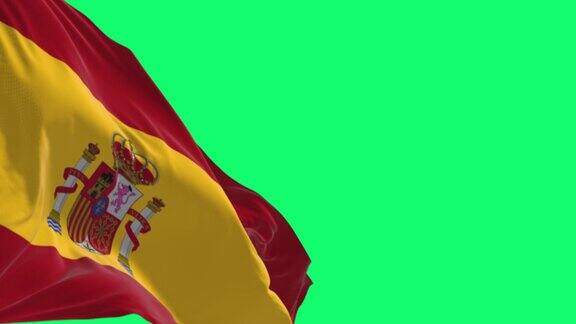 西班牙国旗在绿色背景上孤立地飘扬