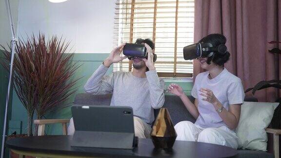 一对夫妇戴着虚拟现实眼镜玩游戏