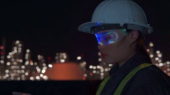 亚洲女性工程师在石油工业工厂使用虚拟现实眼镜工作
