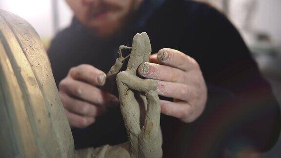 粘土佛像的雕塑手的裁剪视图艺术家用手建模的手