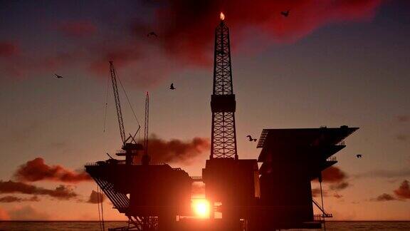 海上的石油钻塔近景美丽的落日
