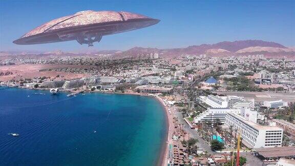 外星人飞碟飞碟在大型度假城市沙漠附近的海航拍