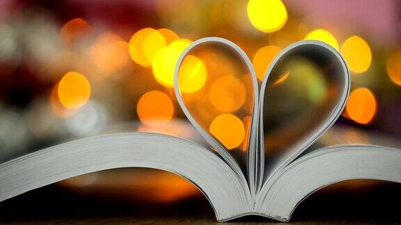 书页装饰成心形与庆祝散光的爱情和浪漫情人节