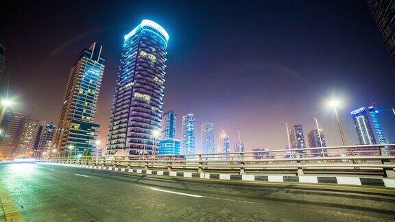 阿拉伯联合酋长国迪拜码头夜间照明交通桥全景4k时间推移