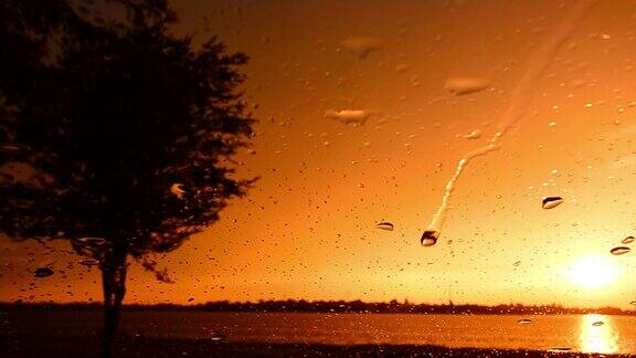 雨滴落下窗前与风景日落在湖