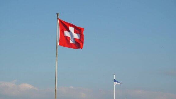阳光明媚的一天苏黎世市湖滨湾国旗慢镜头全景4k瑞士