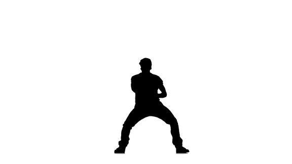运动和时尚的男子跳舞嘻哈kramp在白色的背景慢动作剪影