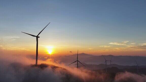 日出时的风力涡轮机