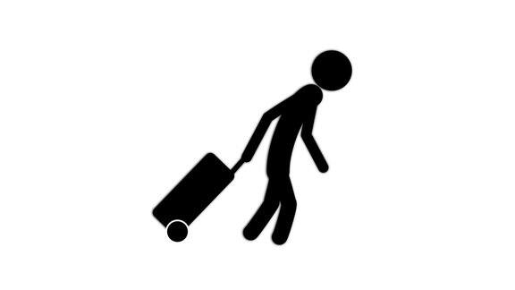 一个男人带着带轮子的行李箱走路4k的视频演示