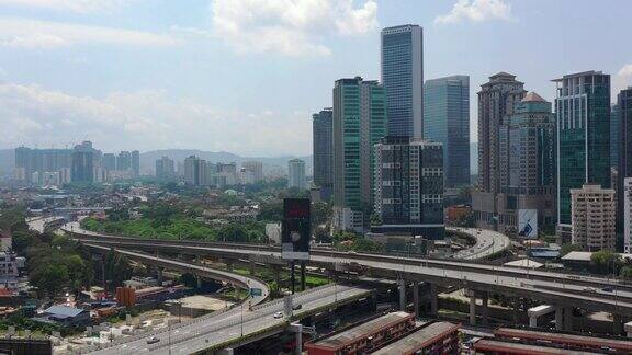 晴天吉隆坡市景中心区交通街道路口航拍4k马来西亚全景图
