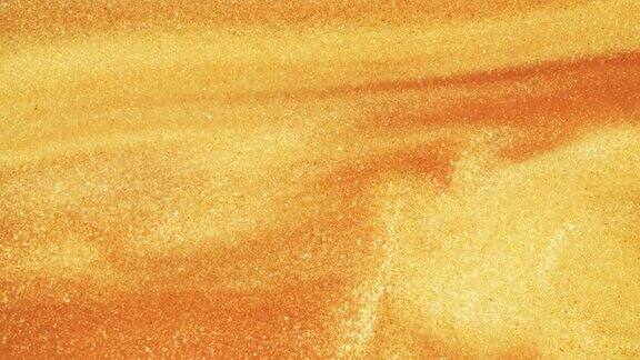 在宏观上彩色的金砂在彩色的液体中有机地移动