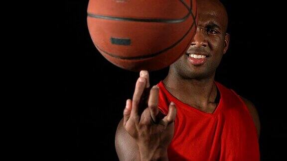篮球运动员用手指旋转球