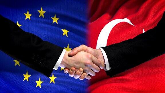 欧盟与土耳其握手国际友谊旗帜背景