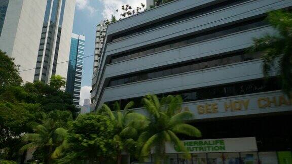 吉隆坡阳光灿烂的一天公路旅行pov大楼上查看全景4k马来西亚