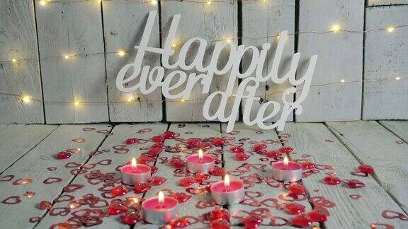 “从此幸福快乐”的标语红心环绕蜡烛点亮backround灯情人节