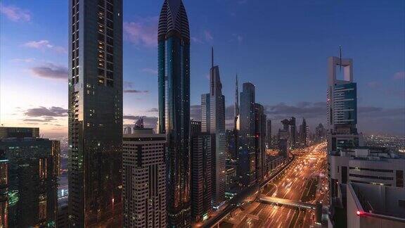 迪拜日出时现代摩天大楼和城市的鸟瞰图阿联酋