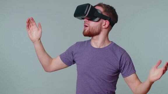 男子使用虚拟现实未来技术VR头戴式头盔玩模拟3D视频游戏