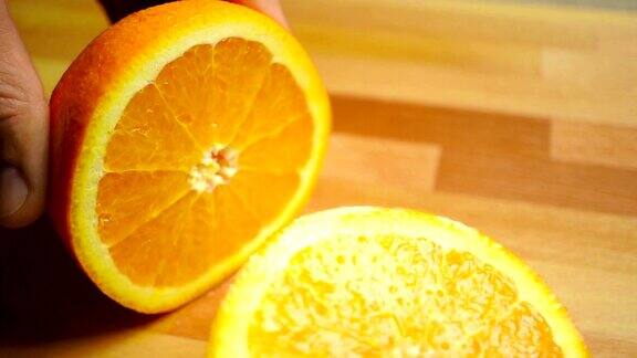 在一个轻木砧板上切整个橙子特写视频