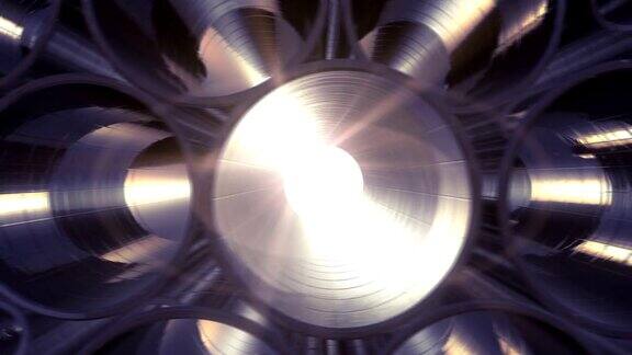 成排的金属管道里面有反射和太阳耀斑循环动画金属工厂的钢管
