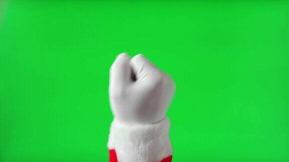 手势圣诞老人手在白色手套敲击隔离色度键绿色屏幕背景4K镜头圣诞老人的拳头手势假期就要到了圣诞节祝贺