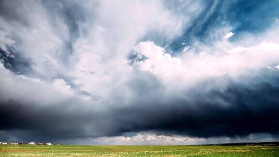 TimeLapseTime-LapseTime-LapseOfRuralFieldSpringMeadowLandscapeUnderScenicDramaticSkyBeforeAndDuringRa