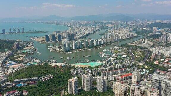 阳光明媚的三亚著名的城市景观岛航拍全景4k海南中国