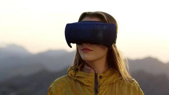 戴着虚拟现实眼镜的年轻女子欣赏着这个风景