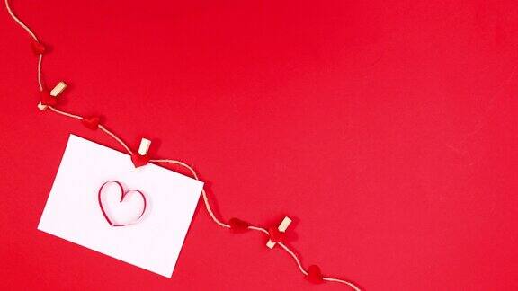 情人节跳动的心在纸上钩上绳子用红心做主题停止运动