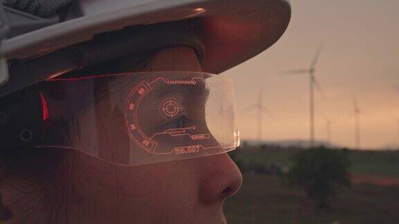 在风力涡轮机农场里戴着虚拟现实眼镜的工程师