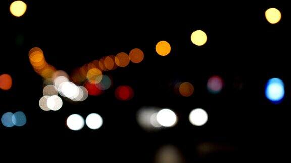 散焦灯洛杉矶街道抽象城市模糊背景夜景交通的移动散景圈