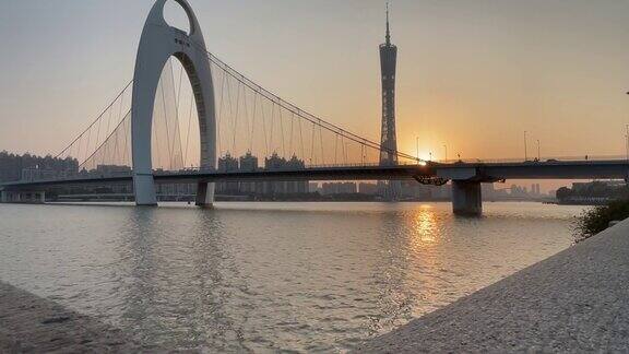 延时拍摄的广州日落展现了广州塔、烈德大桥和珠江的独特景观广州城市的中国南方的大都市
