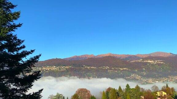 高山湖卢加诺的全景与云海和山在一个晴朗的秋日