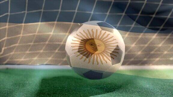 足球在草地上弹跳阿根廷国旗在足球场的前景上飘扬
