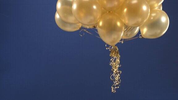 一个装饰元素-金色气球-出现在视频中作为礼物情人节生日圣诞节或新年在Chroma钥匙