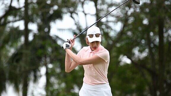 慢动作亚洲中国女高尔夫球手打高尔夫开球
