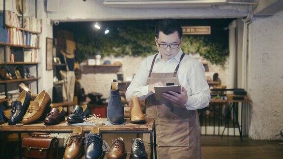 亚洲男鞋店工人在男装鞋店安排展示