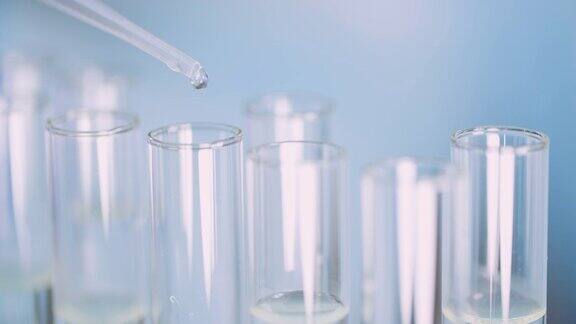 科学家在实验室使用移液管的极端特写