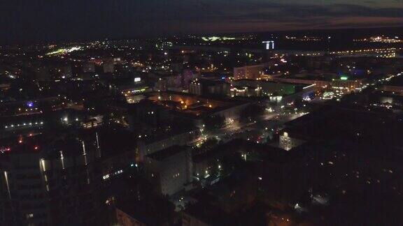 空中夜景摩天大楼照亮了现代城市的街道剪辑