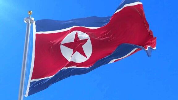 朝鲜国旗迎风飘扬蓝天环绕