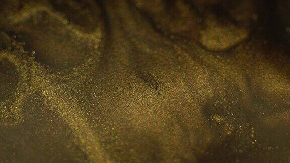 金属暗金色液体亮漆纹理抽象的闪亮的背景