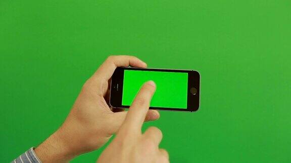 智能手机在绿色屏幕上点击手势水平