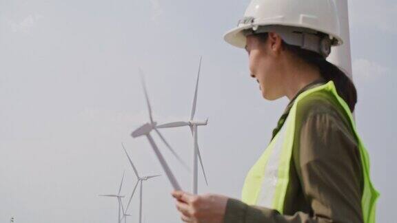 可再生能源系统电力维护工程师在风力涡轮机发电厂的现场工作