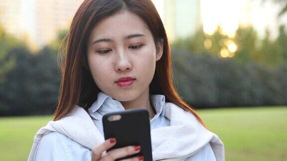 4k:美丽的亚洲女孩在公园中国上海