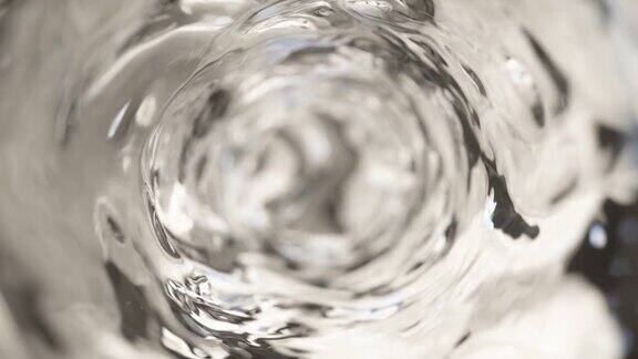 杯子里的水是慢动作的摘要水背景无缝循环3d渲染