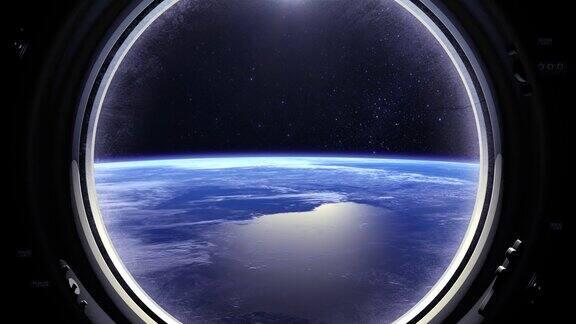 透过宇宙飞船的窗户看到的地球国际空间站向右飞行现实的气氛体积云从空间星星闪烁空间、地球轨道