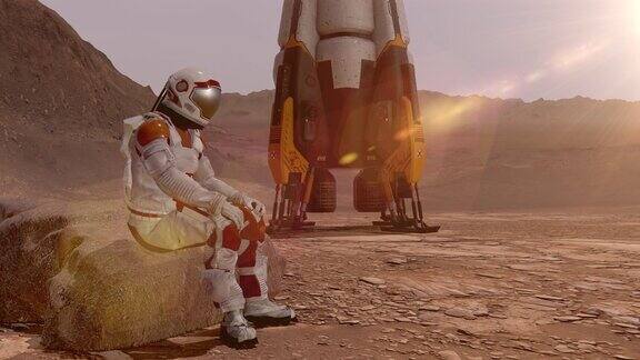 宇航员坐在火星上欣赏风景火星探索任务未来主义殖民和空间探索概念这段视频由美国宇航局提供三维渲染
