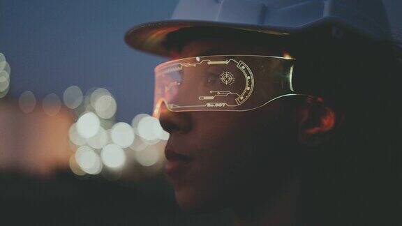 未来女工程师戴着虚拟现实眼镜在石油工厂的夜晚