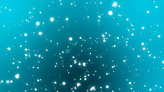水下的光粒子在蓝绿色的背景上闪烁