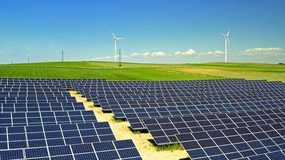 太阳能电池板和风力涡轮机在绿色领域鸟瞰图波兰